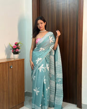 Women’s Teal Blue Mul Cotton Saree with White Floral Print and Decorative Printed Border