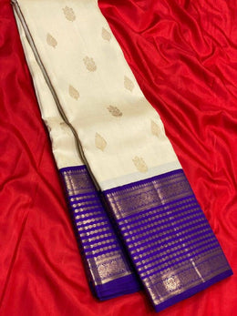 Cream White Silk Saree for Women with Golden Butti and Royal Blue Zari Jacquard Border