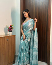 Women’s Teal Blue Mul Cotton Saree with White Floral Print and Decorative Printed Border