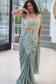 Women’s Green Saree with Embroidered Border and Designer Sleeveless Blouse