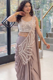 Women’s Green Saree with Embroidered Border and Designer Sleeveless Blouse