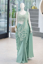 Women’s Green Saree with Embroidered Border and Designer Sleeveless Blouse