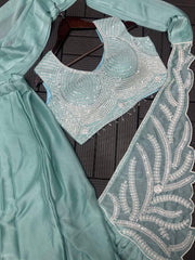 Women’s Green Saree with Embroidered Border and Designer Sleeveless Blouse
