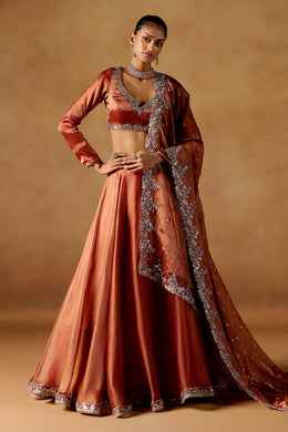 Women’s Orange Embroidered Lehenga Choli with Dupatta.