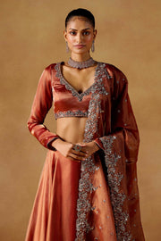 Women’s Orange Embroidered Lehenga Choli with Dupatta.